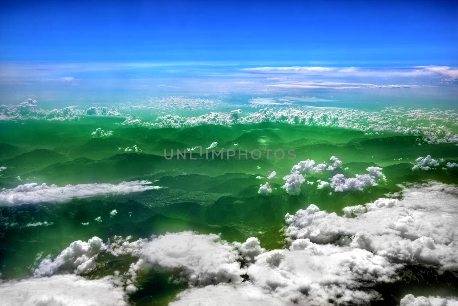 High in the blue sky, puffy white clouds