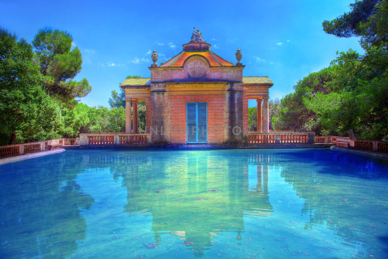 Summer park with water pool and relaxation place.