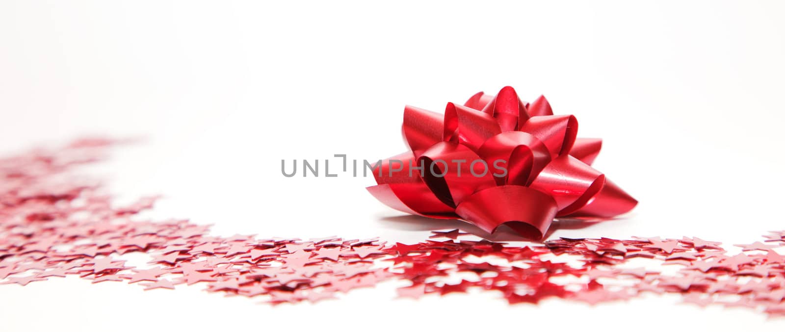 Christmas decoration, red ribbon and stars by photocreo