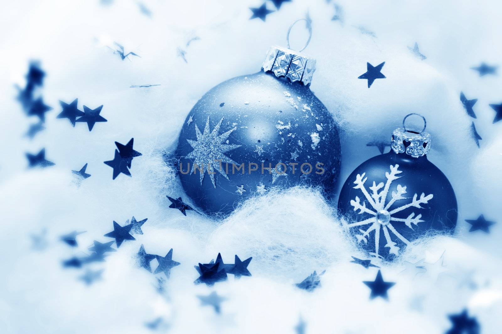 Christmas balls frozen in soft cotton wool resembling snow