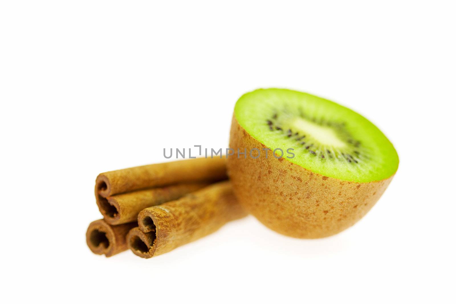kiwi and cinnamon isolated on white
