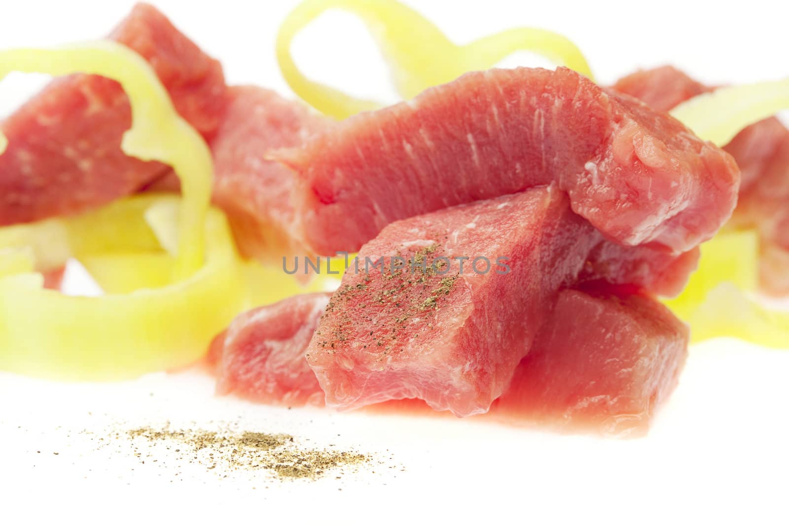 Juicy slices of pork and pepper isolated on white