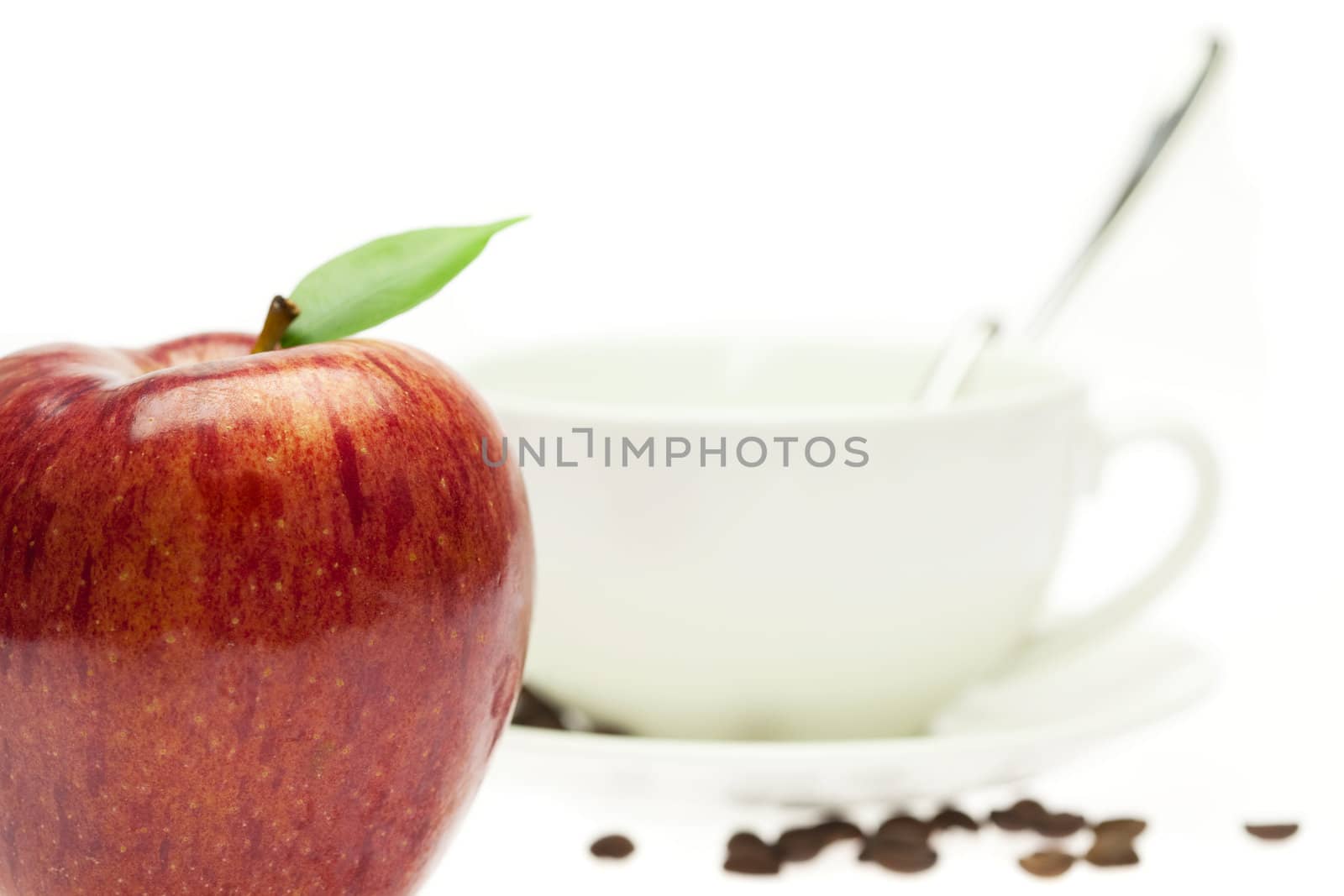 apple and a cup  isolated on white