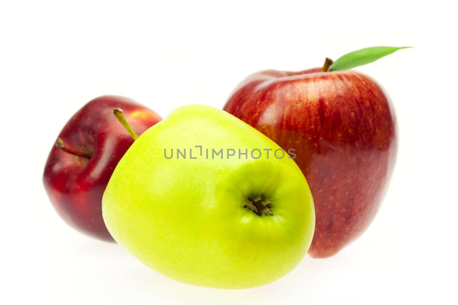 red apples with leaves isolated on white