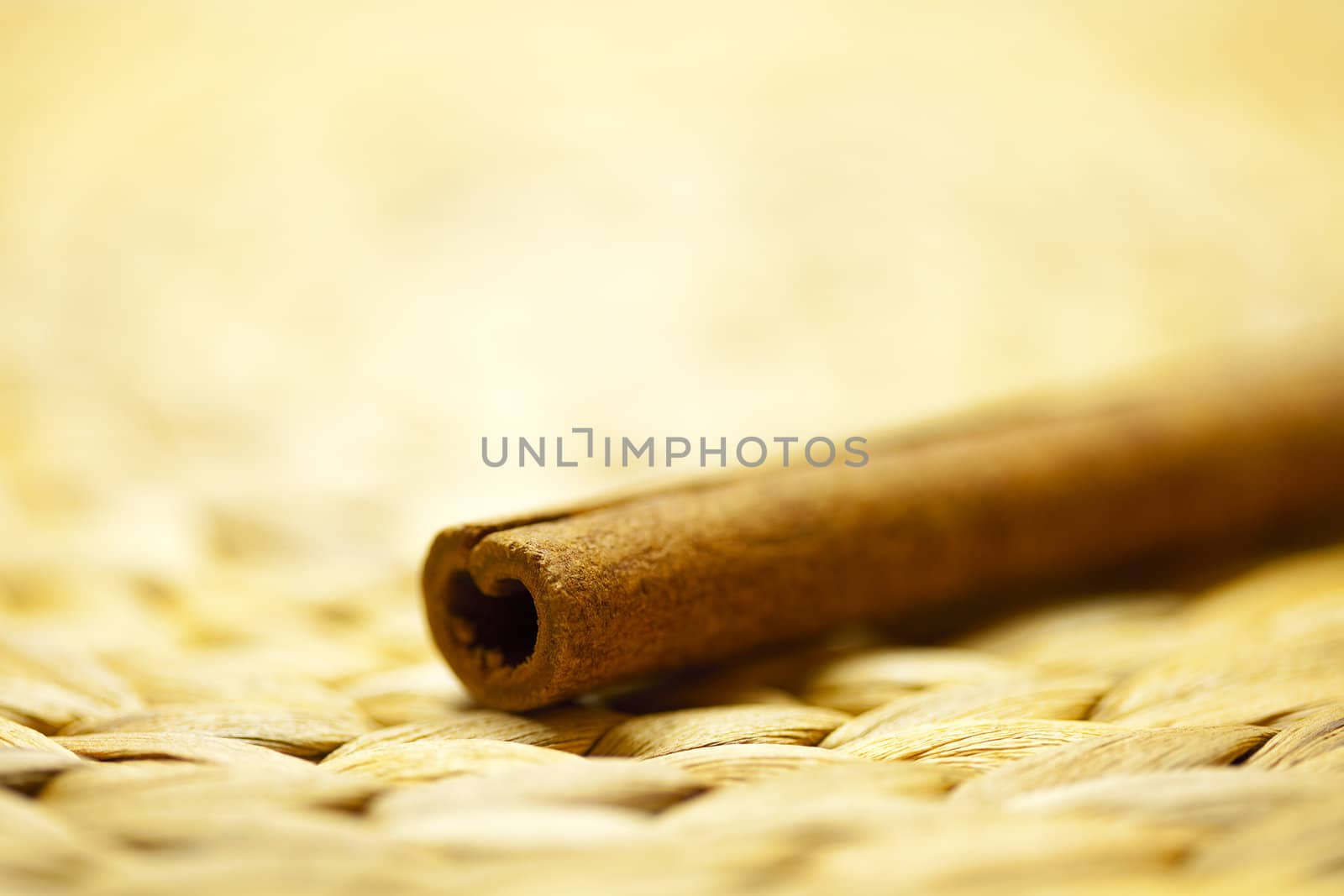 cinnamon sticks on a wicker mat by jannyjus