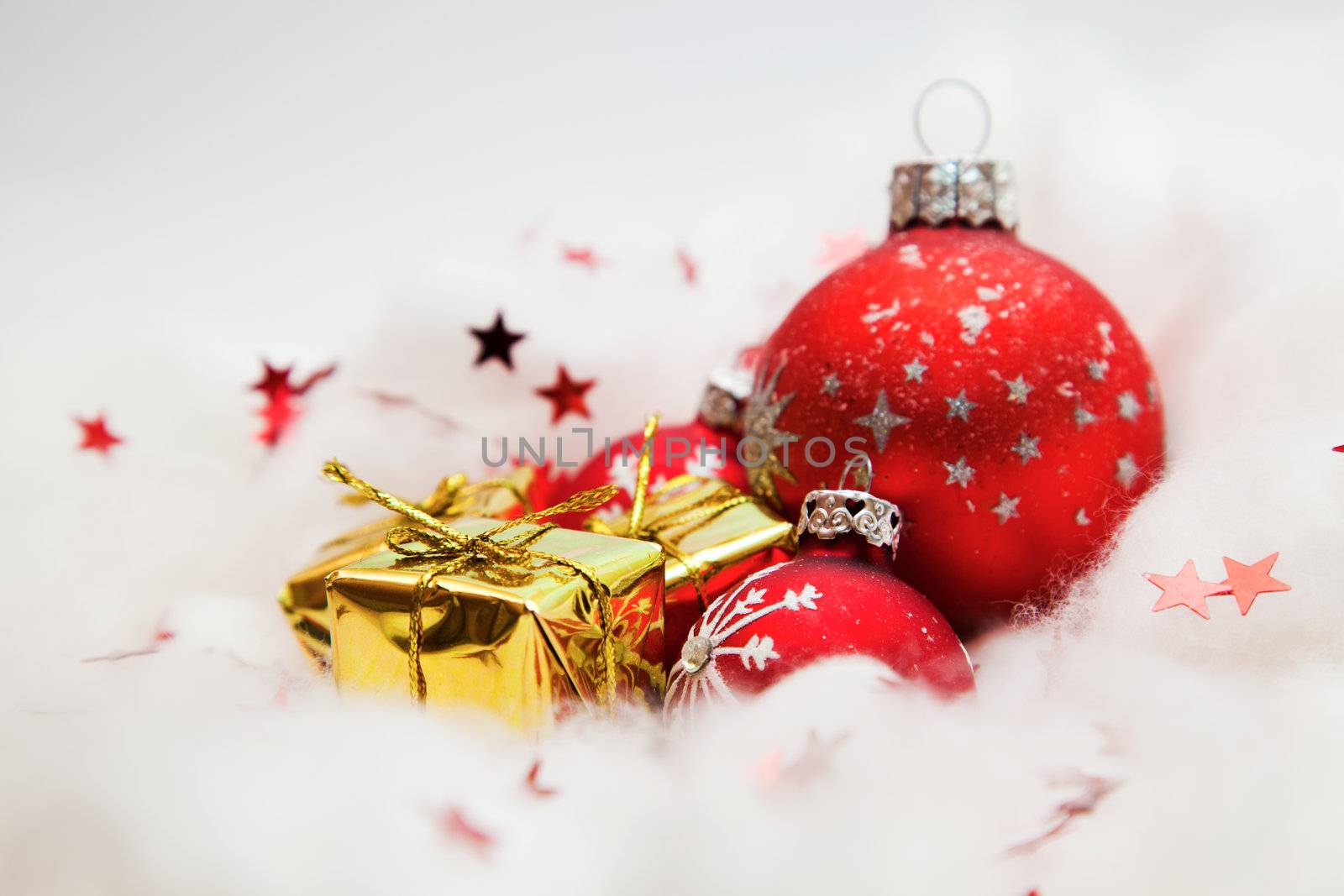 Christmas balls frozen in soft cotton wool resembling snow