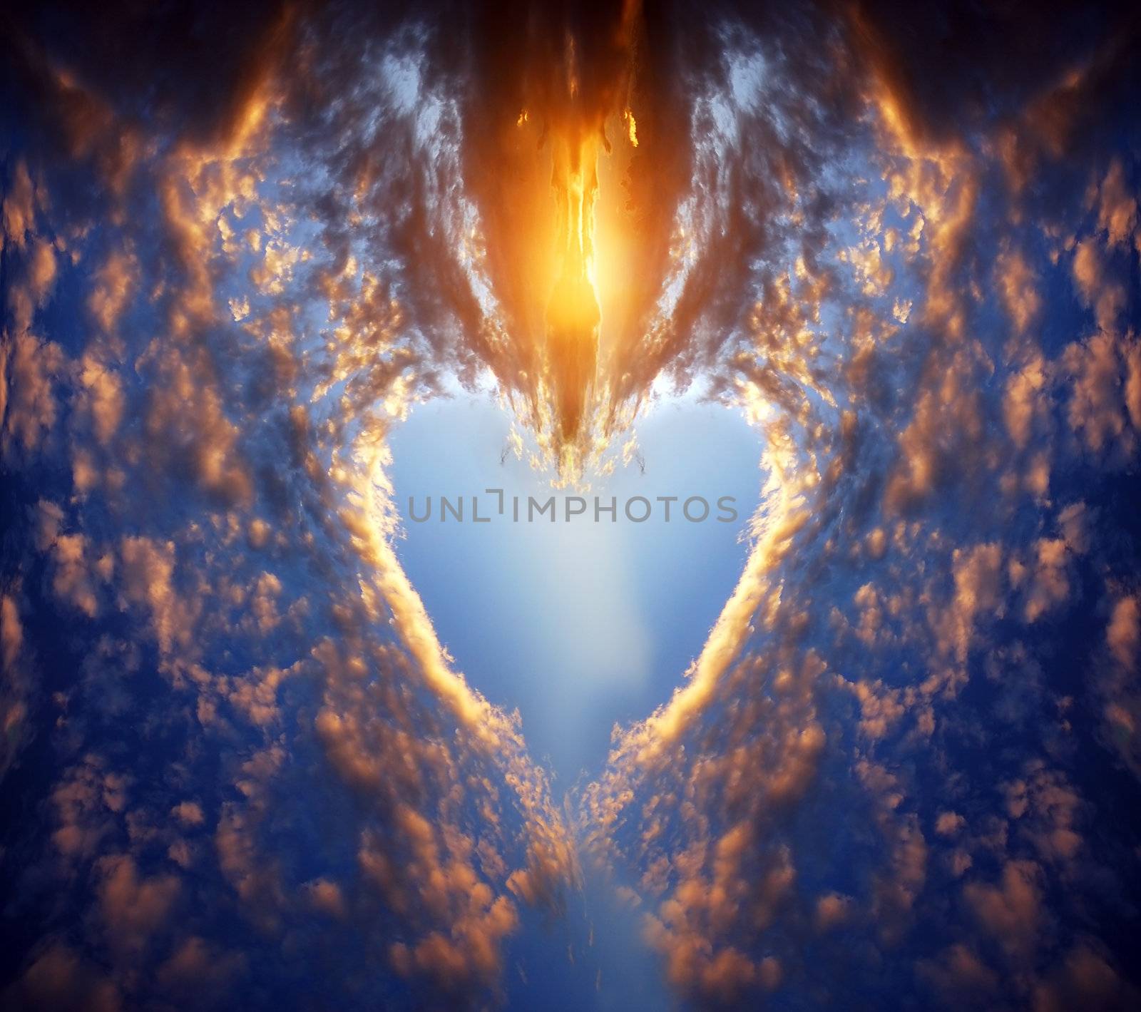 Heart shape made of clouds on a sunset sky. Love, romance, religion concepts