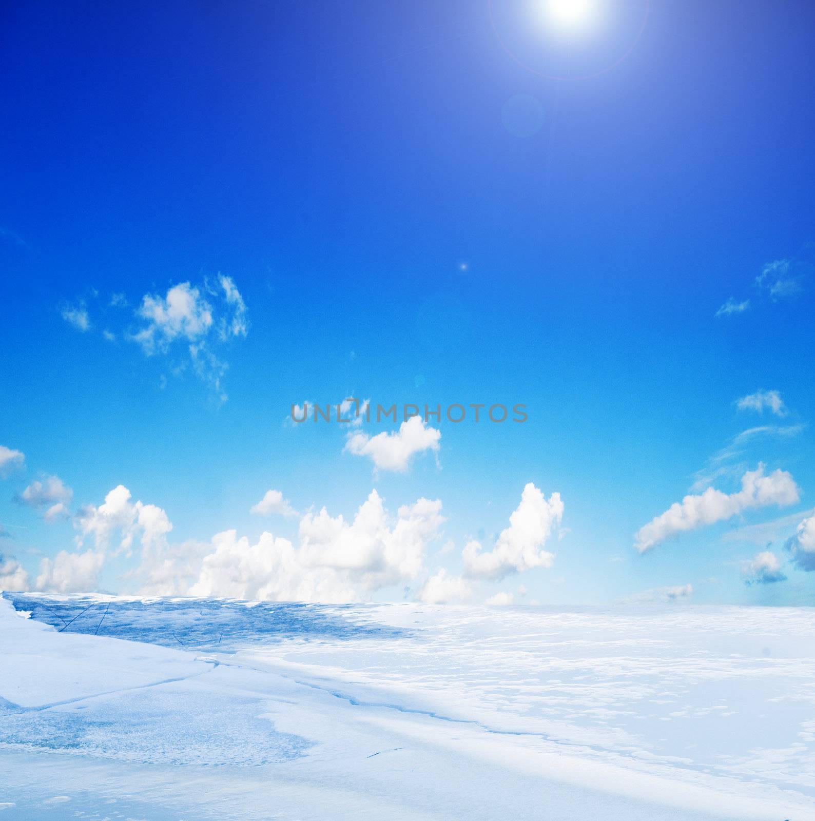 Snowy winter landscape and sunny blue sky