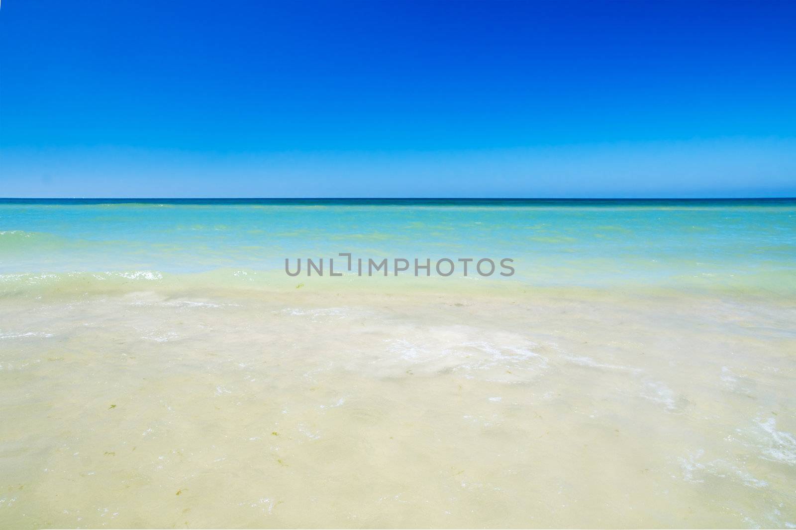 Tropical beach, sunny blue sky
