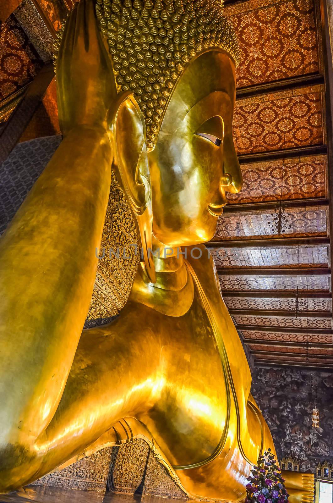 Reclining Buddha gold statue in Wat Pho, Bangkok, Thailand