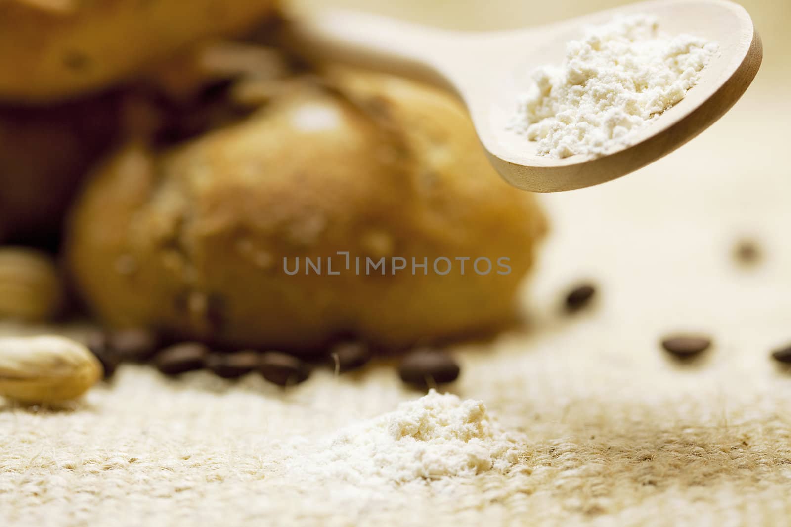 bread and flour  on a wicker mat by jannyjus