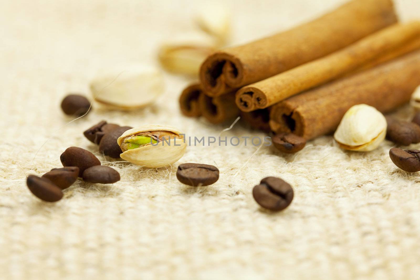 cinnamon and coffee  on a wicker mat by jannyjus