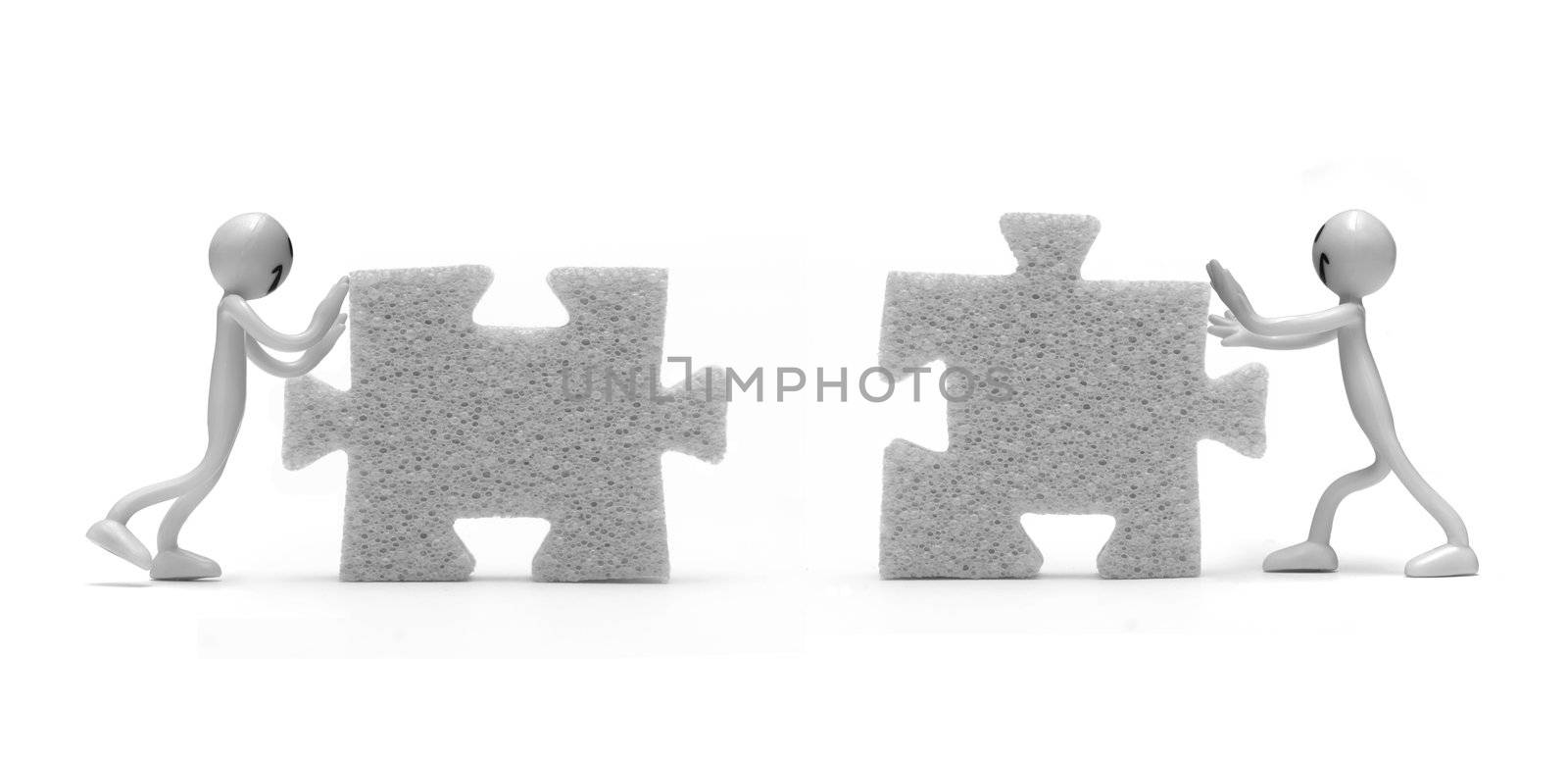 Putting two pieces of puzzles together. Conceptual image