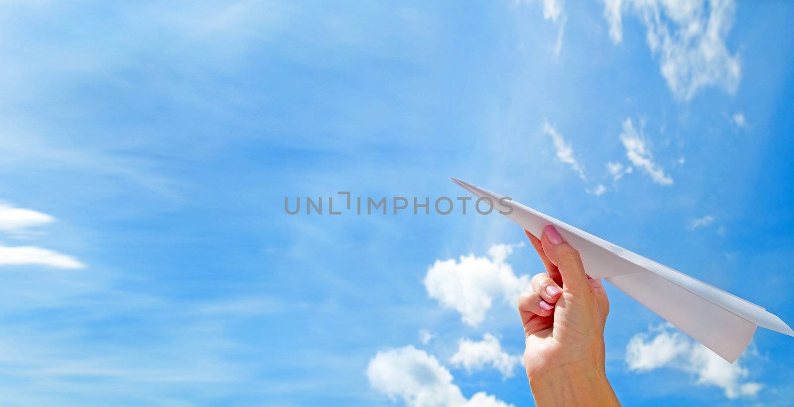 Throwing a paper plane in the sky. Freedom, success, vacation, business concepts