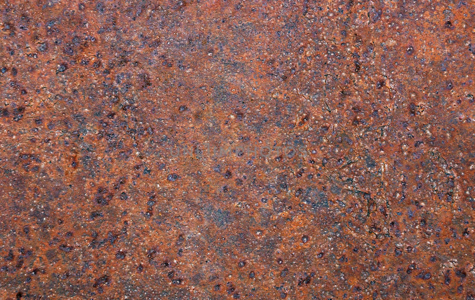 patterned colored oxidation products on the surface of metal