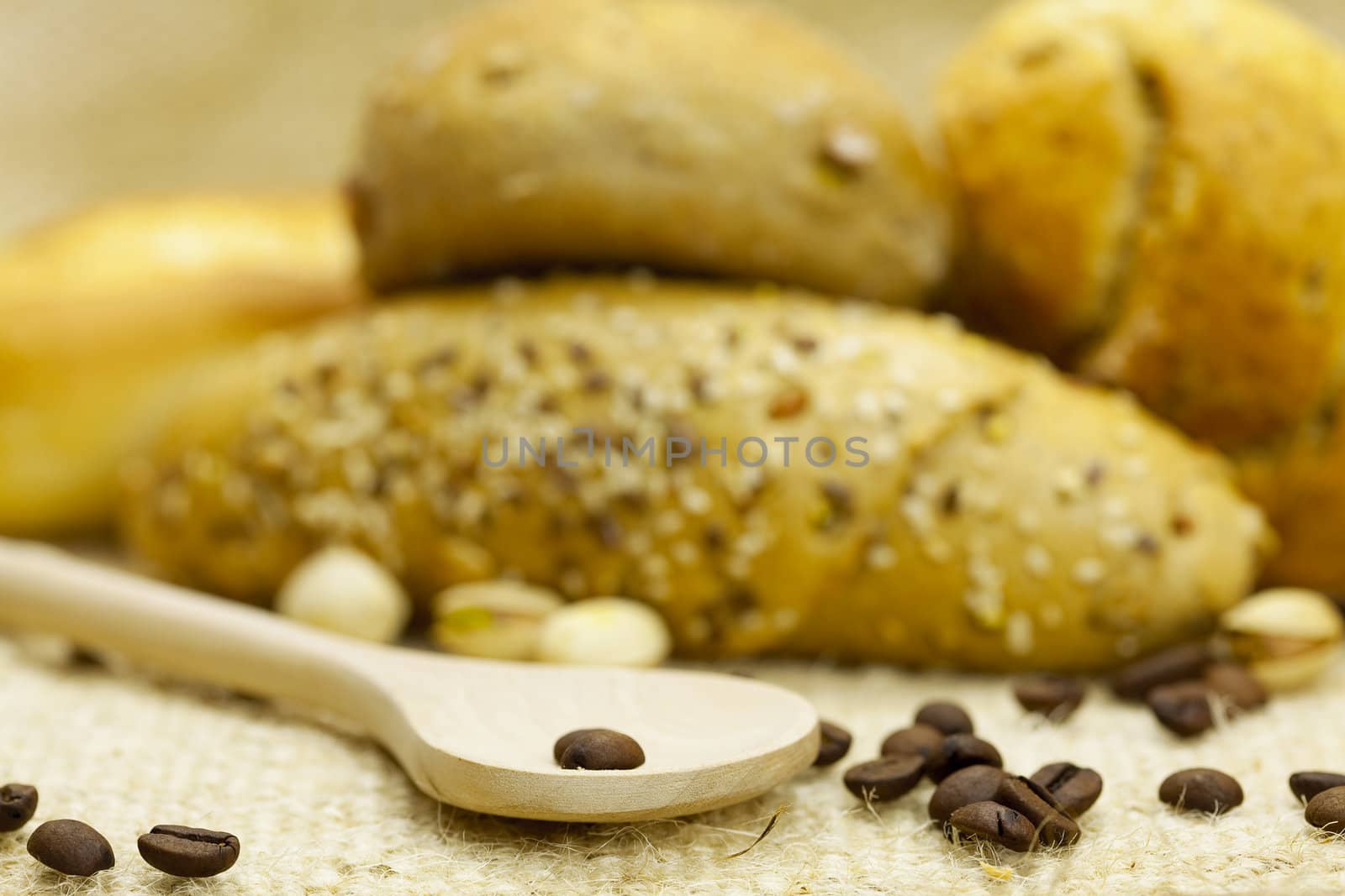 bread , coffee and flour in a spoon on a wicker mat by jannyjus