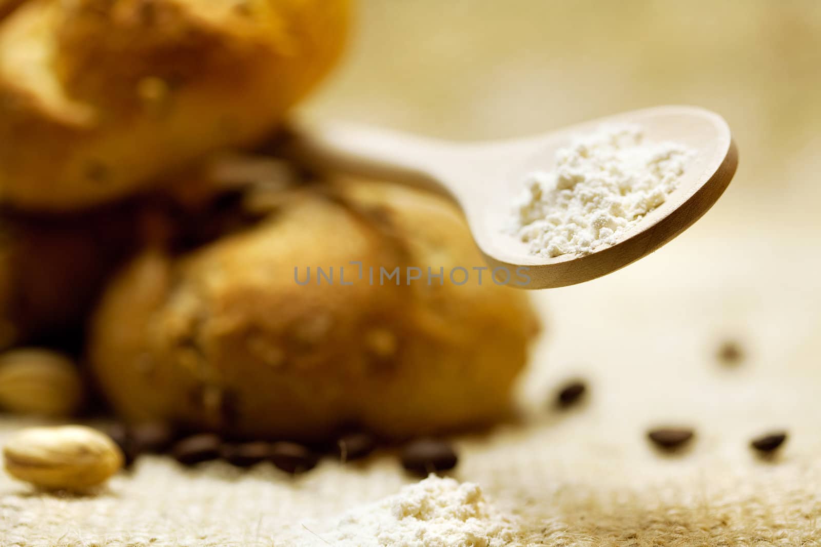 bread and flour in a spoon on a wicker mat