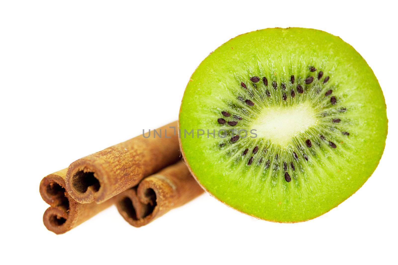 kiwi and cinnamon isolated on white by jannyjus