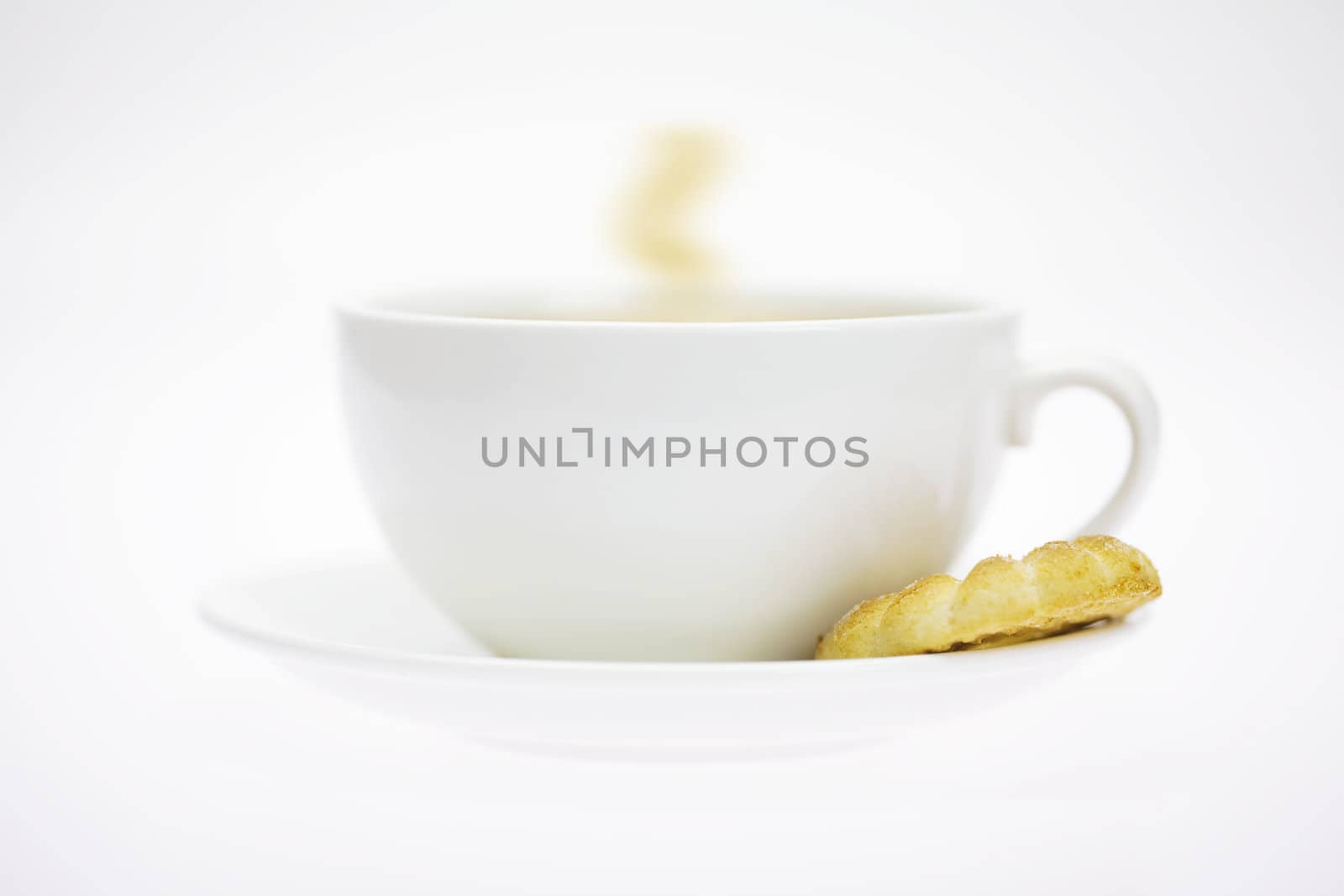 white cup and pastry isolated on white by jannyjus