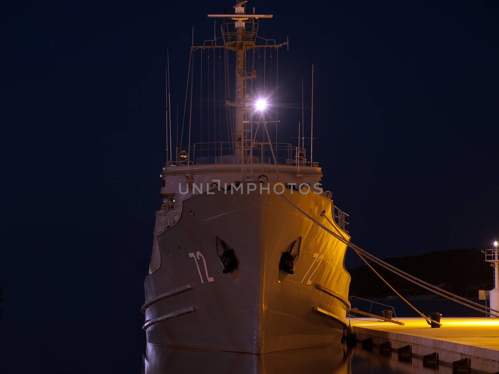 military ship anchored in winter night