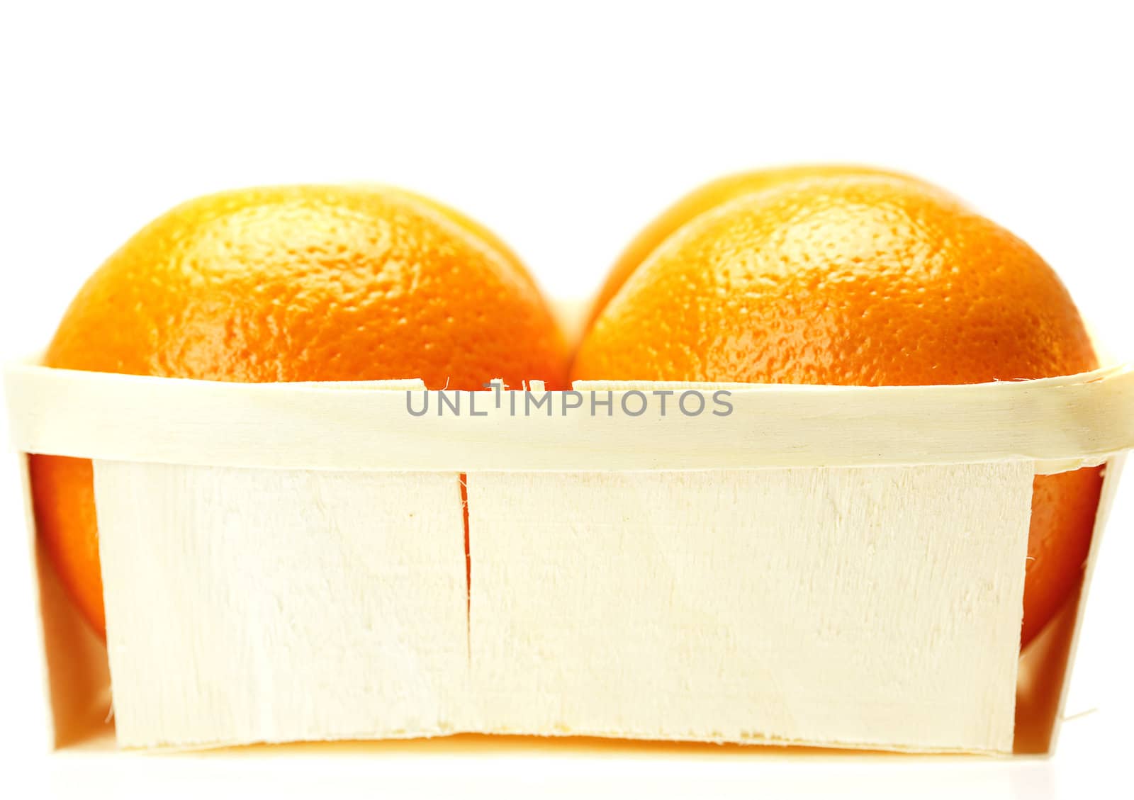 oranges in a box isolated on white by jannyjus