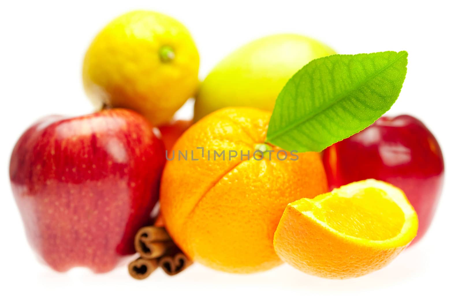 apple, orange, lemon and cinnamon, isolated on white by jannyjus