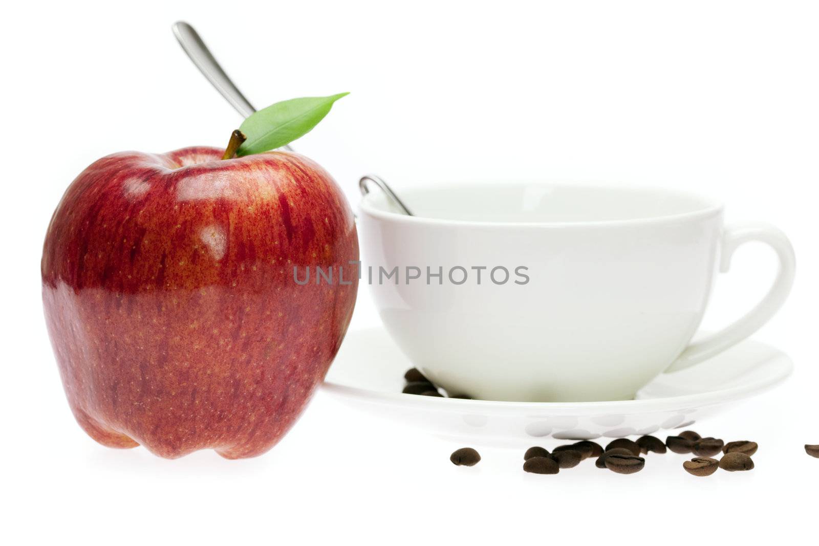 apples in a bowl, spoon and coffee beans isolated on white