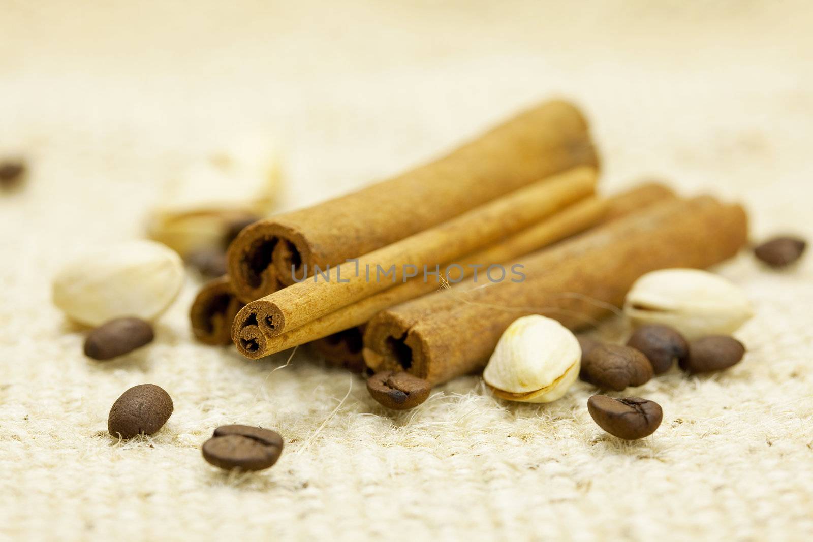 cinnamon and coffee  on a wicker mat by jannyjus