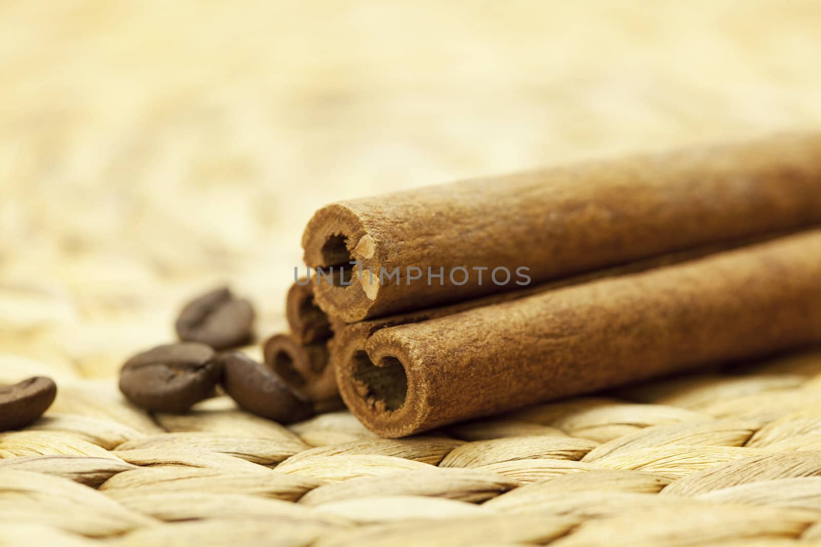 cinnamon sticks on a wicker mat