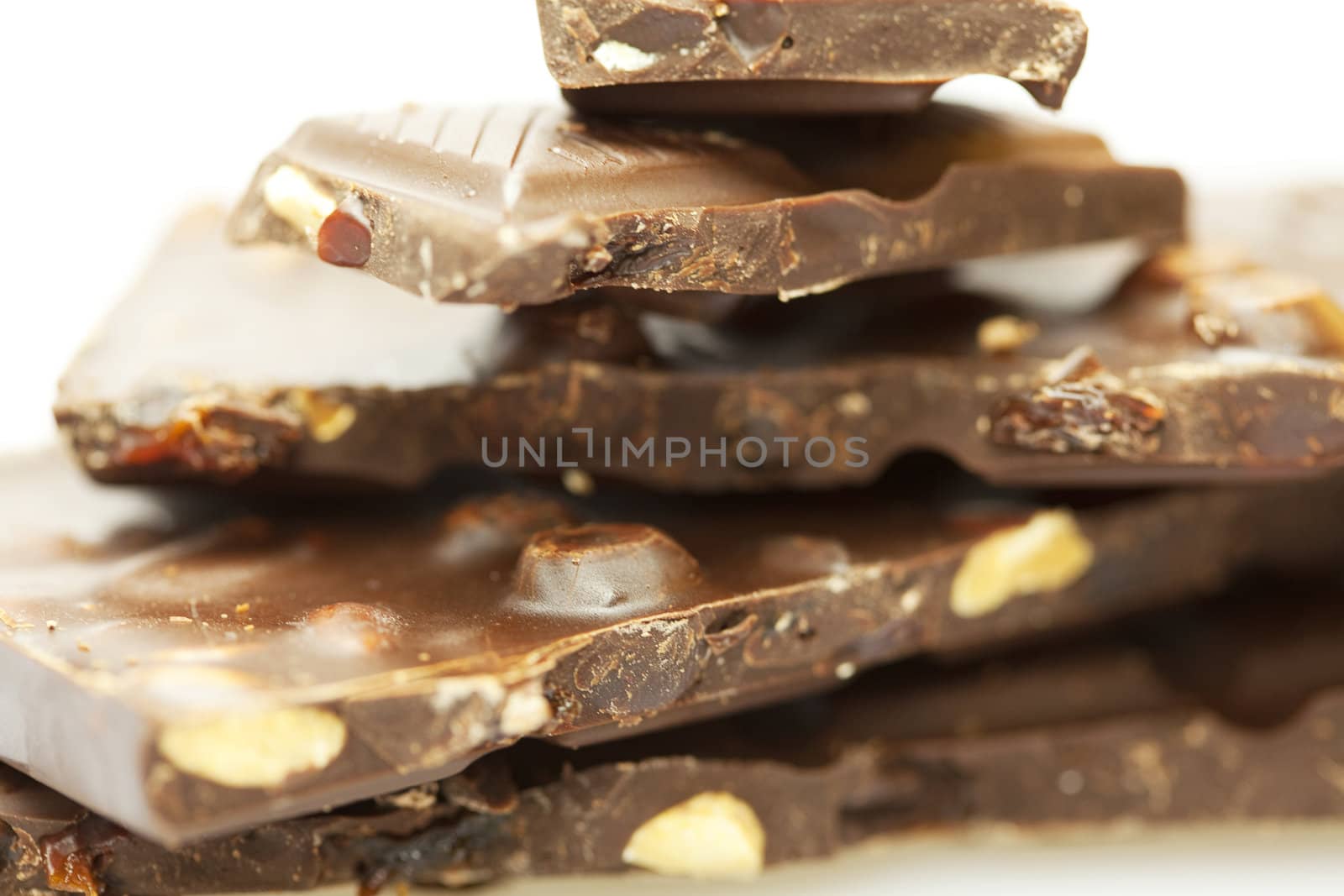 stacks of pieces of chocolate isolated on white by jannyjus