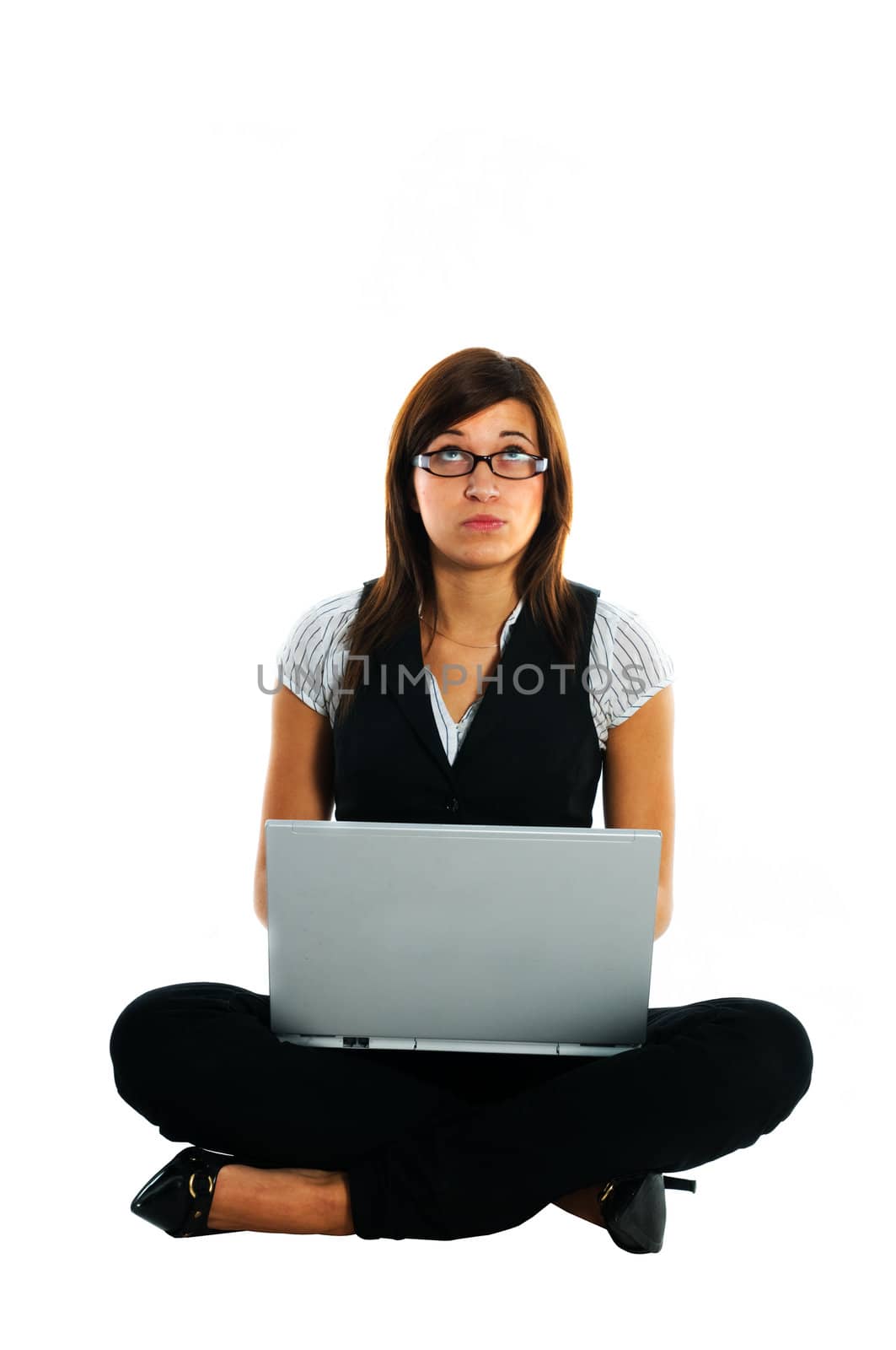 Thoughtful businesswoman with laptop by photocreo