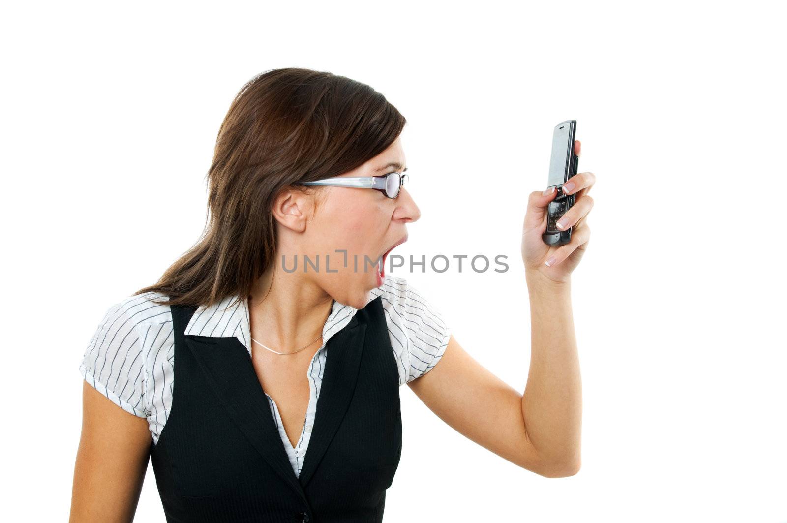 Angry businesswoman shouting to a mobile. Isolated on white