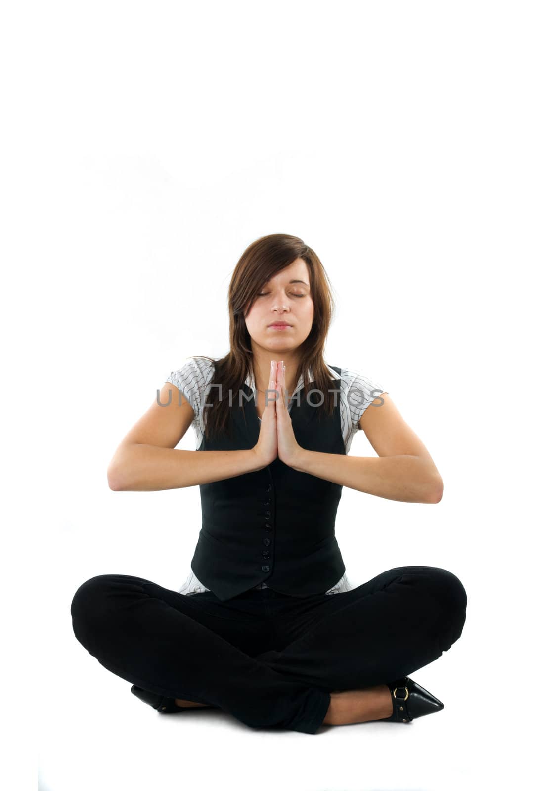 Businesswoman relaxing, meditating. Isolated on white background