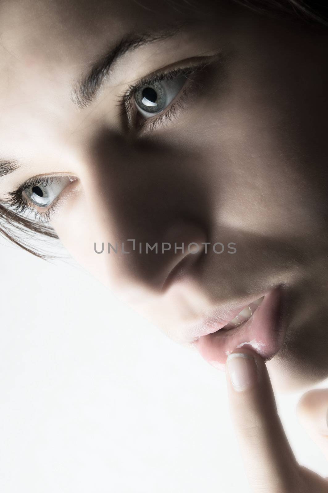 Young beautiful female model. Face close up