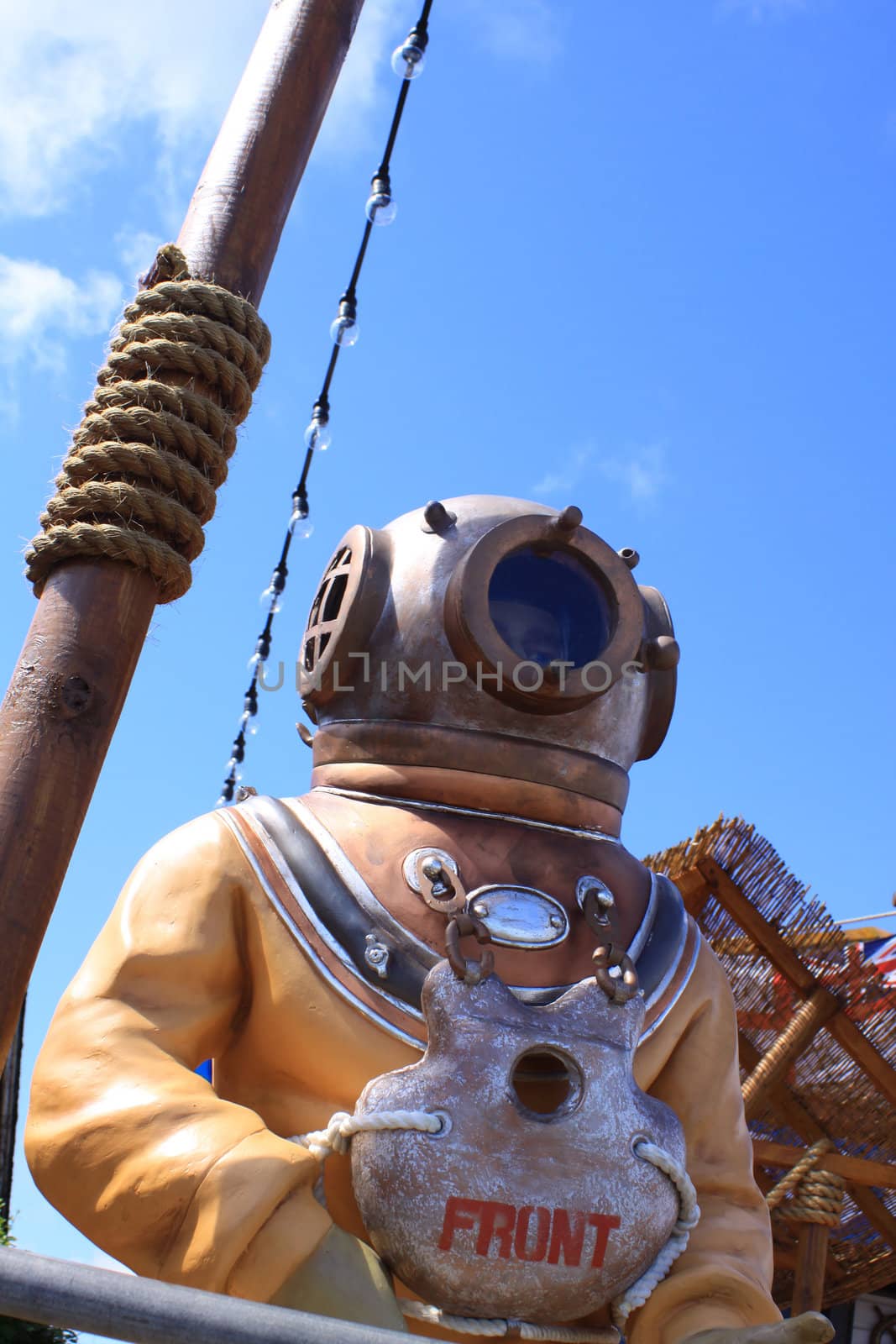 A model statue of a diver in an old fashioned diving suit. Located on the sefront in Swanage, Devon.