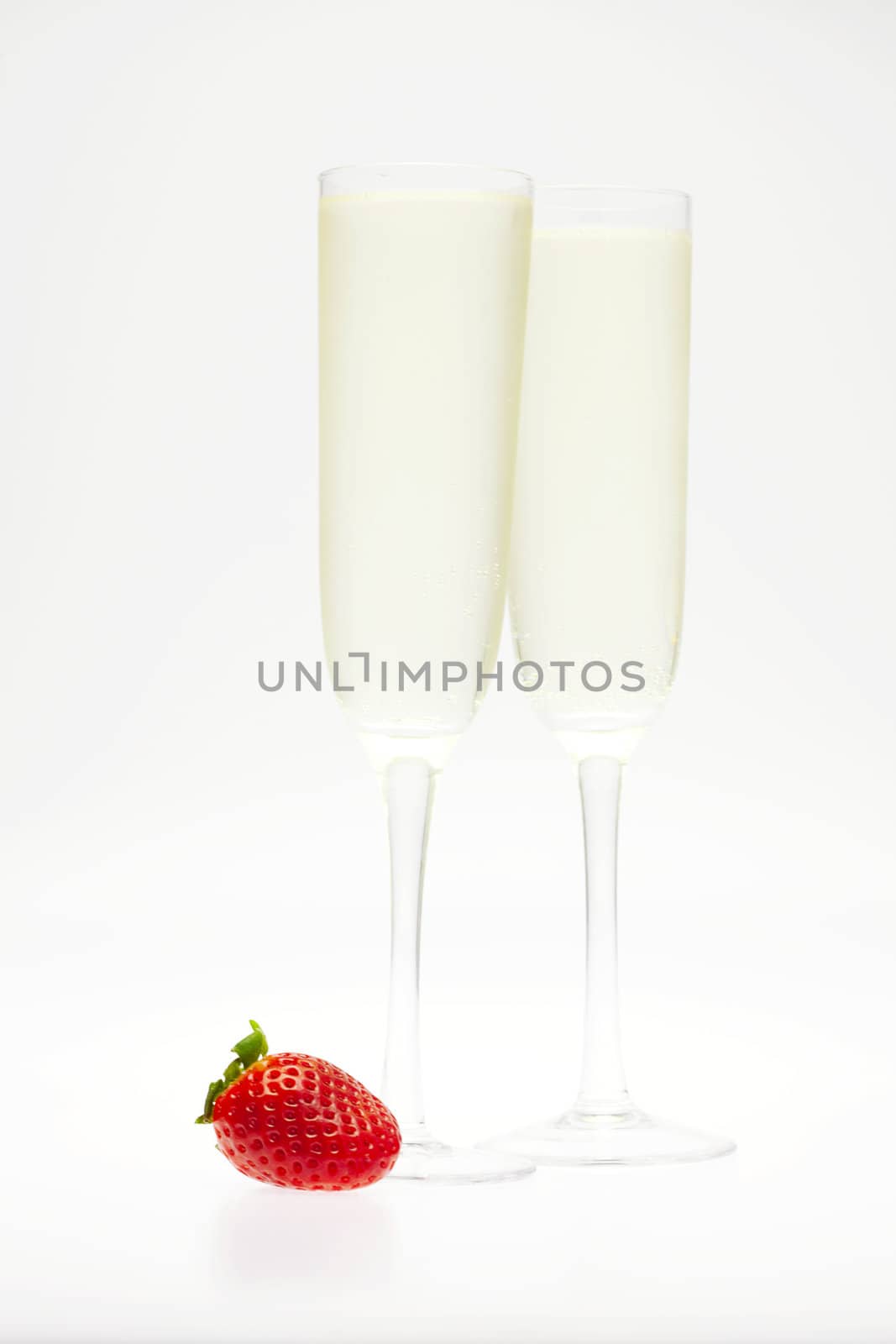 a glass of champagne and strawberries by jannyjus