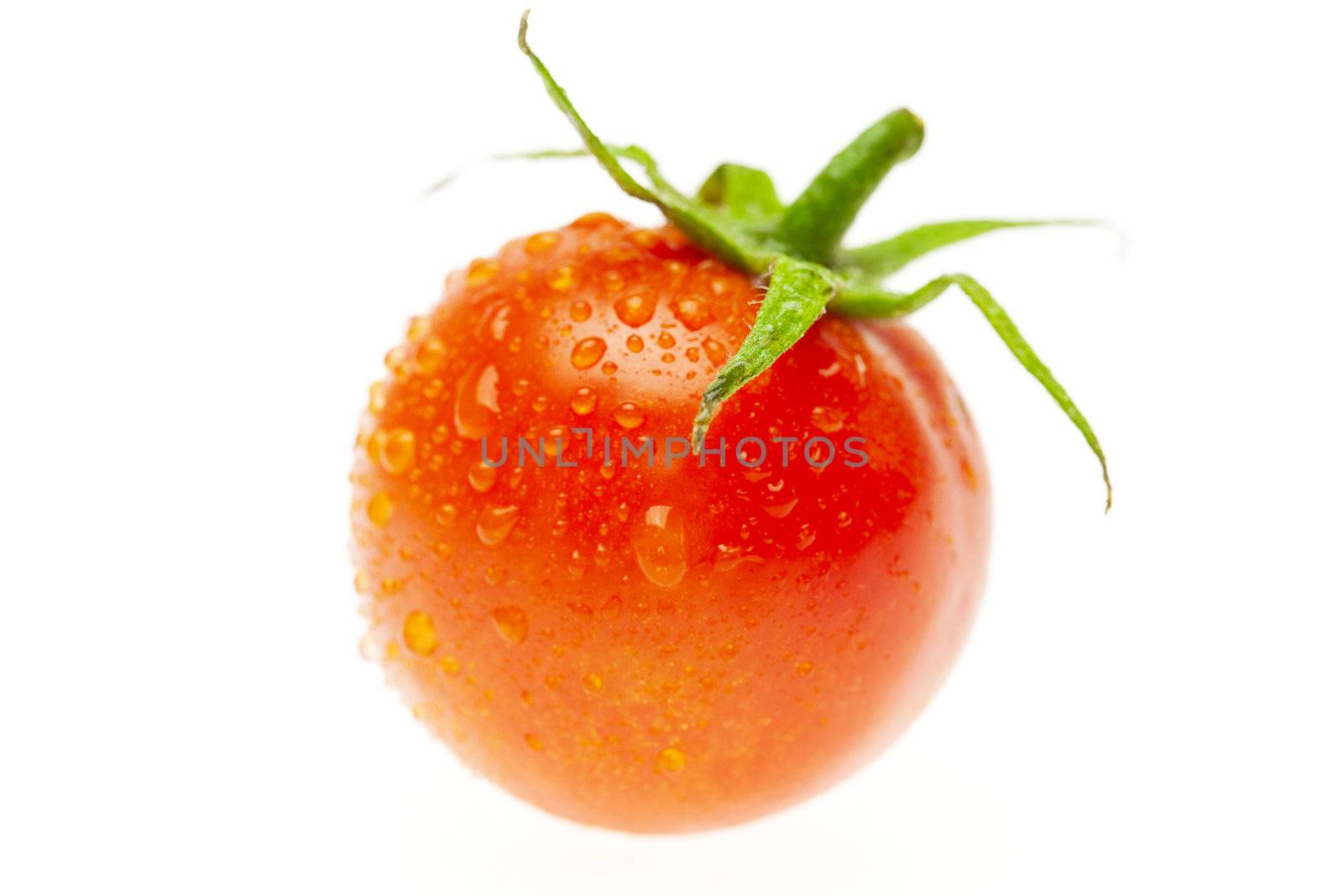 juicy tomato isolated on white by jannyjus