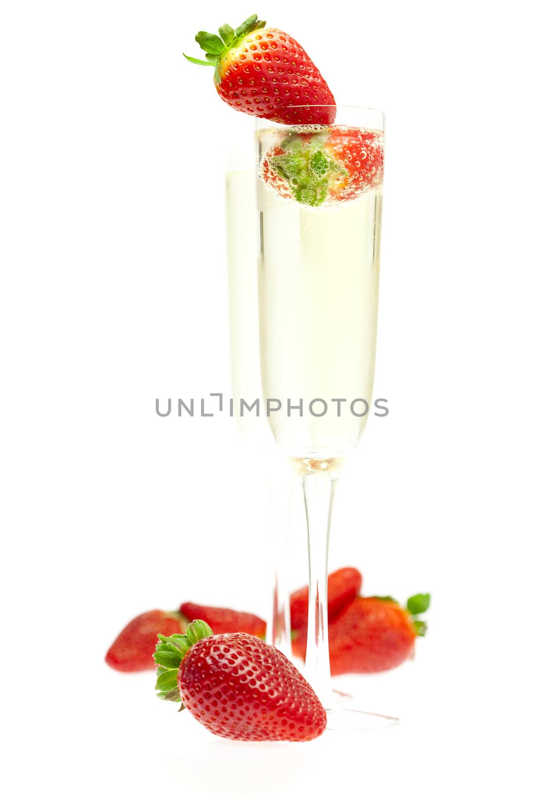 a glass of champagne and strawberries by jannyjus