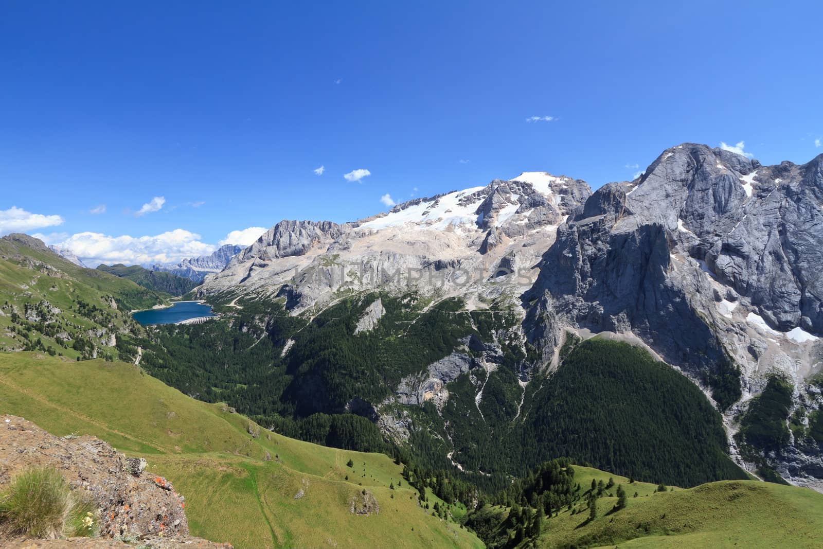 summer view of mount Marmolada and Fedaia lake, Trentino, Italy