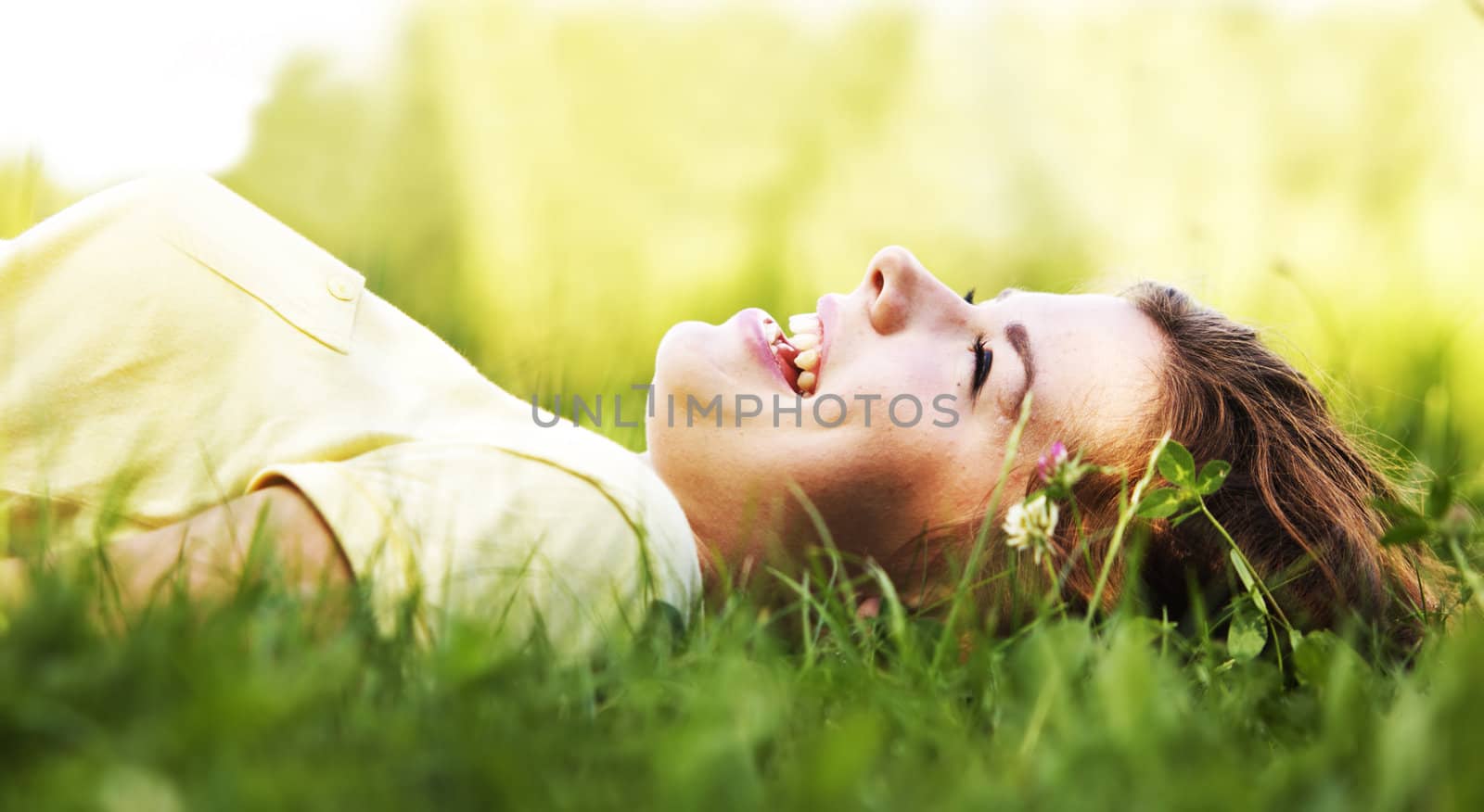 Pretty smiling girl relaxing outdoor