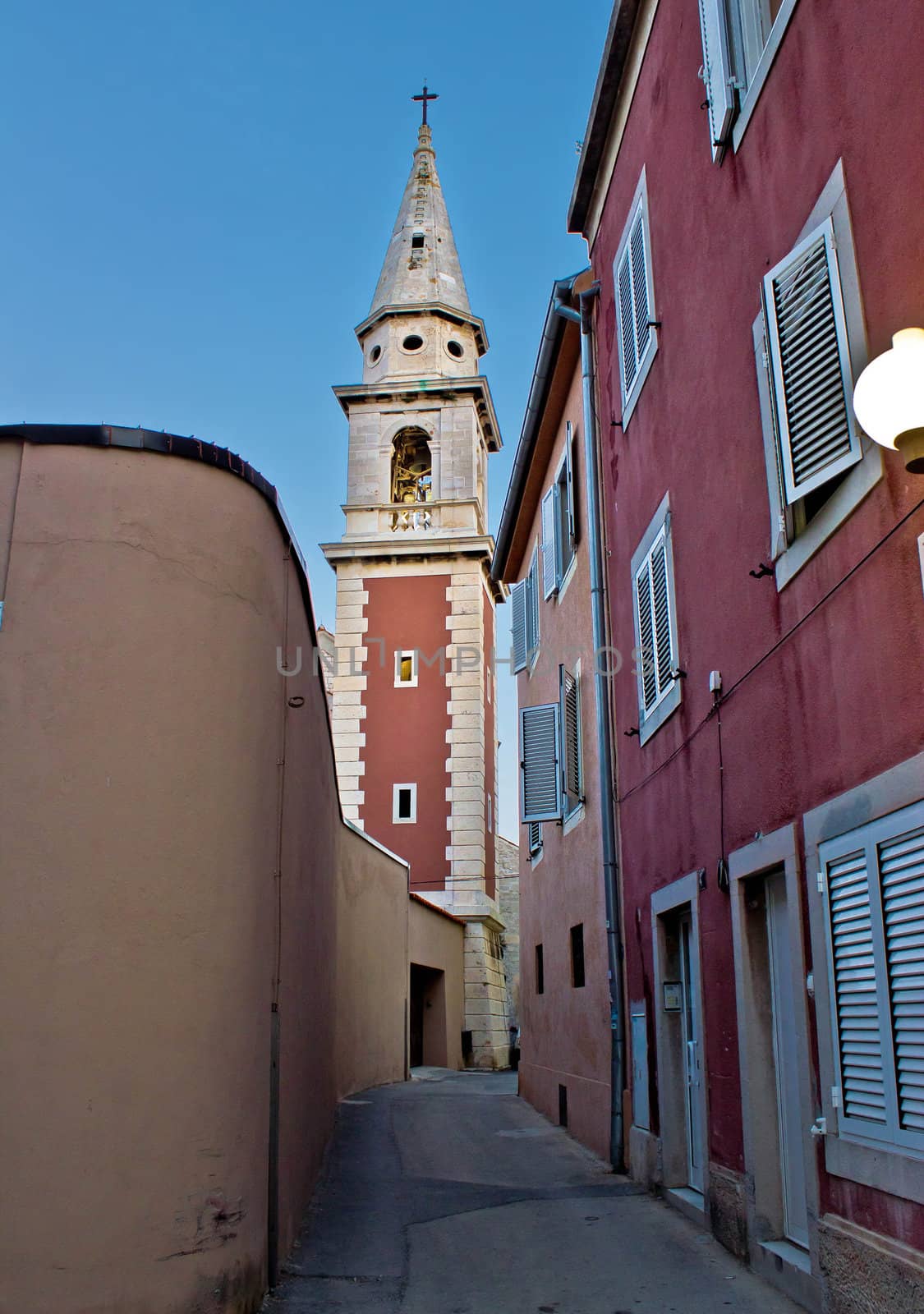 Old narrow street with church tower in Zadar, Dalmatia, Croatia