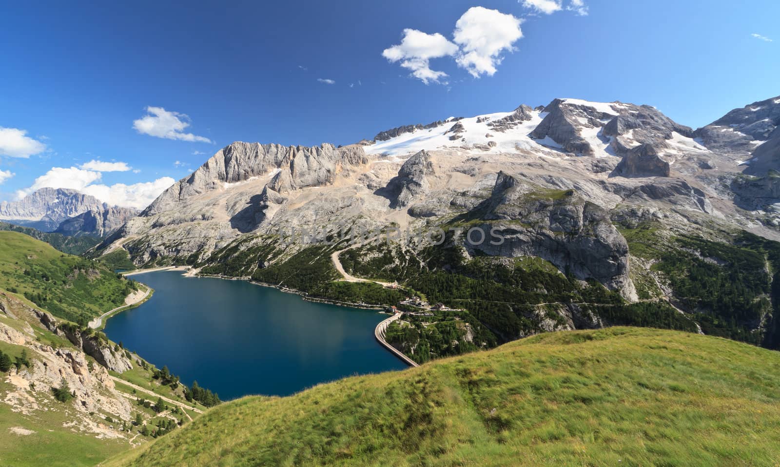 summer view of mount Marmolada and Fedaia lake, Trentino, Italy