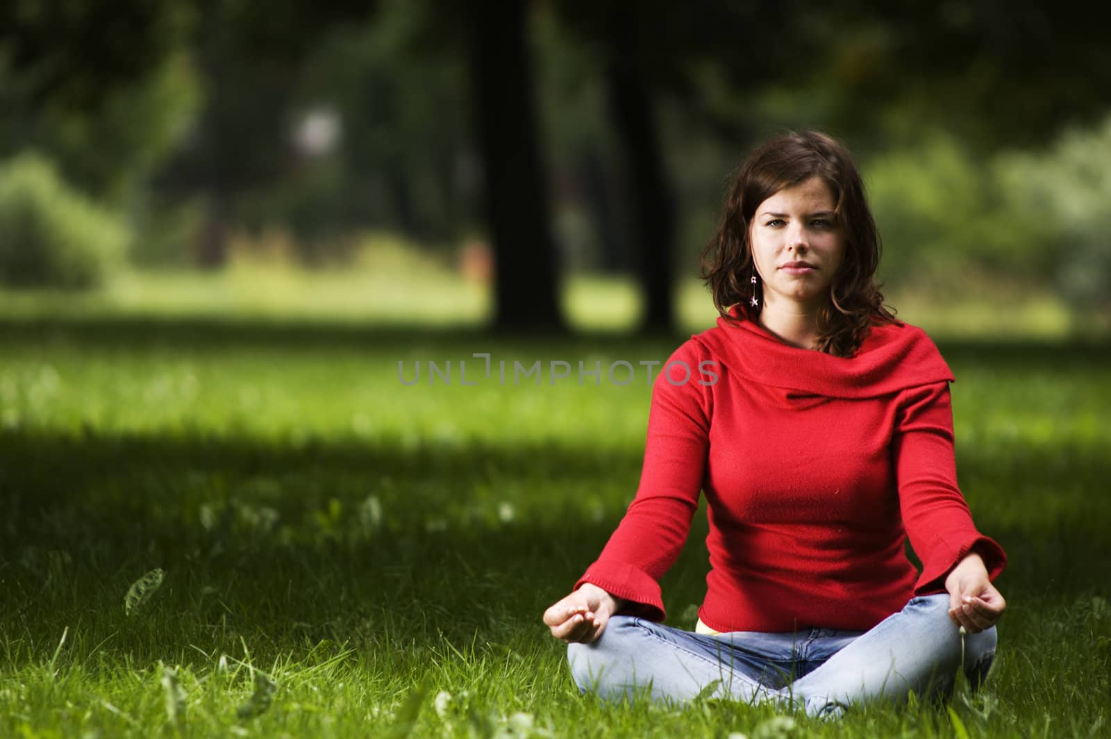 Young woman doing yoga by photocreo