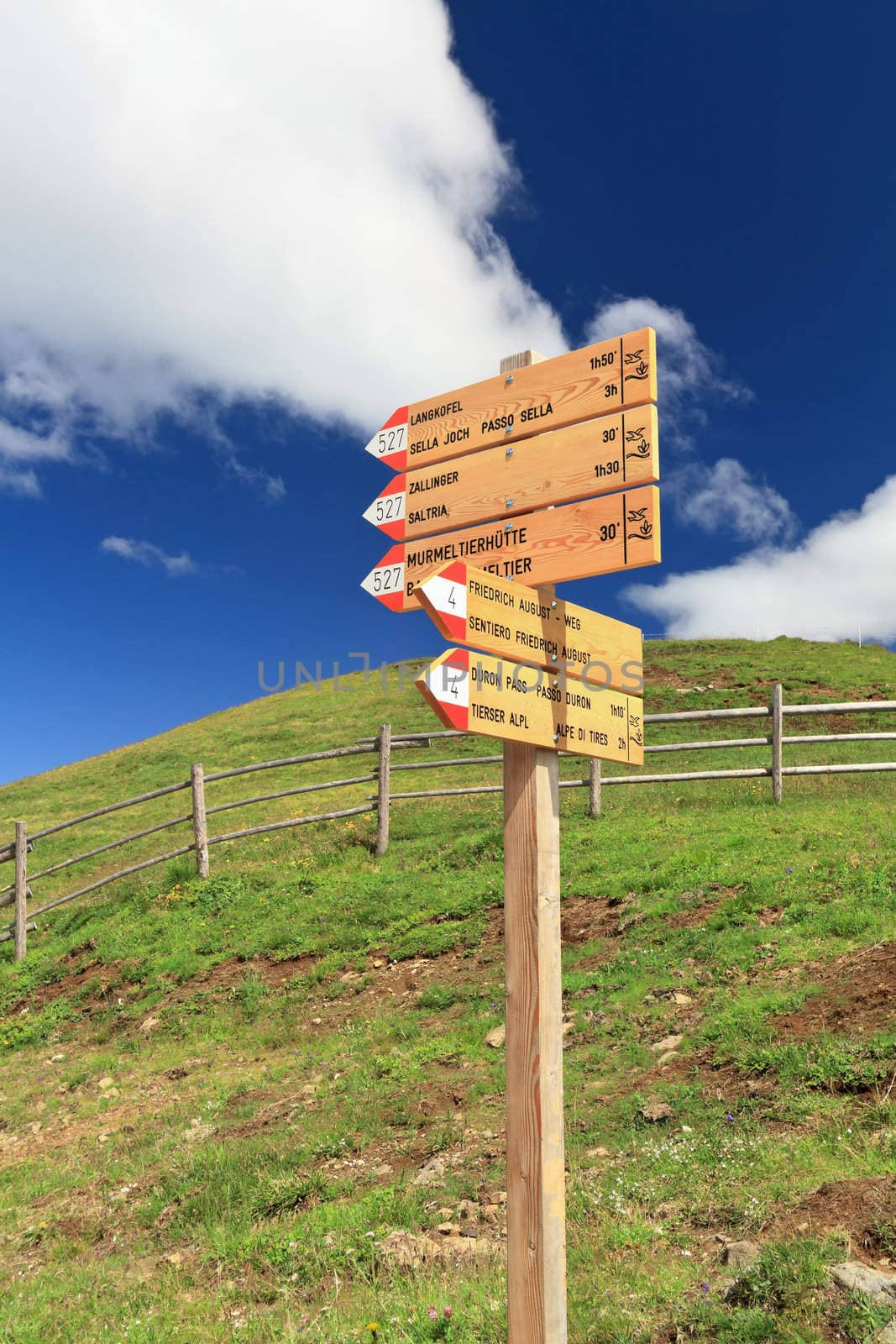 signs for trekking in Italian Dolomites on a sunny day