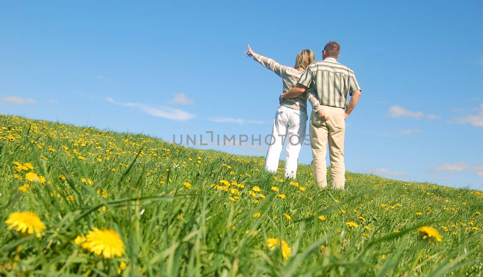 Couple in love on spring meadow