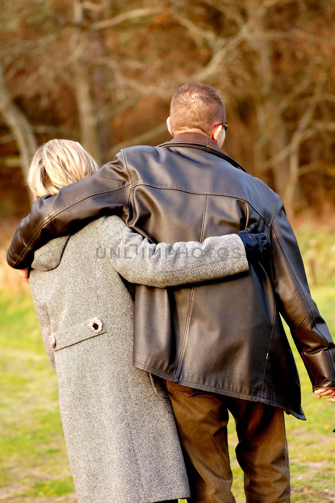 Happy couple in outdoor, autumn scenery