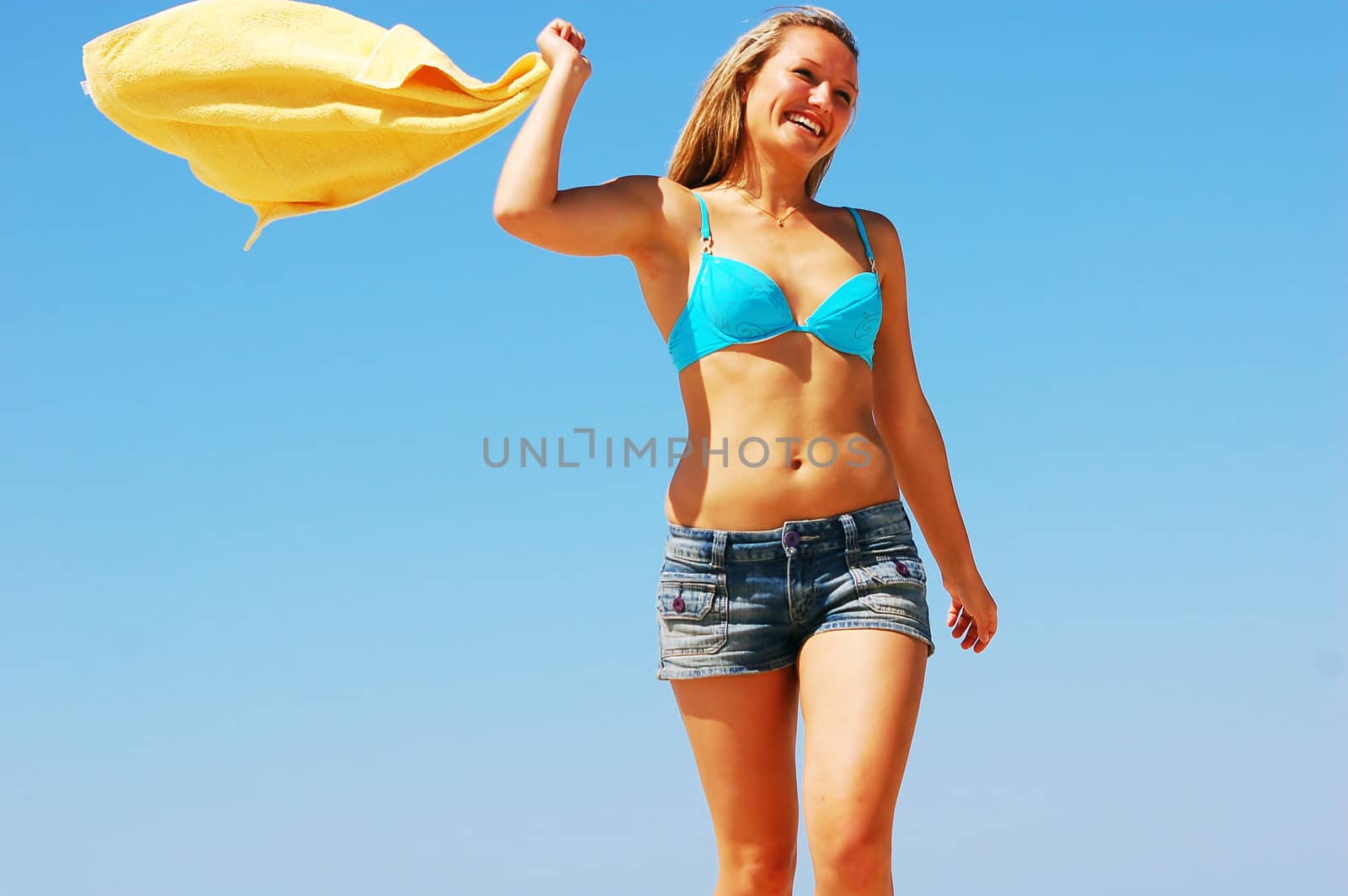 Young attractive woman enjoying summertime on the beach