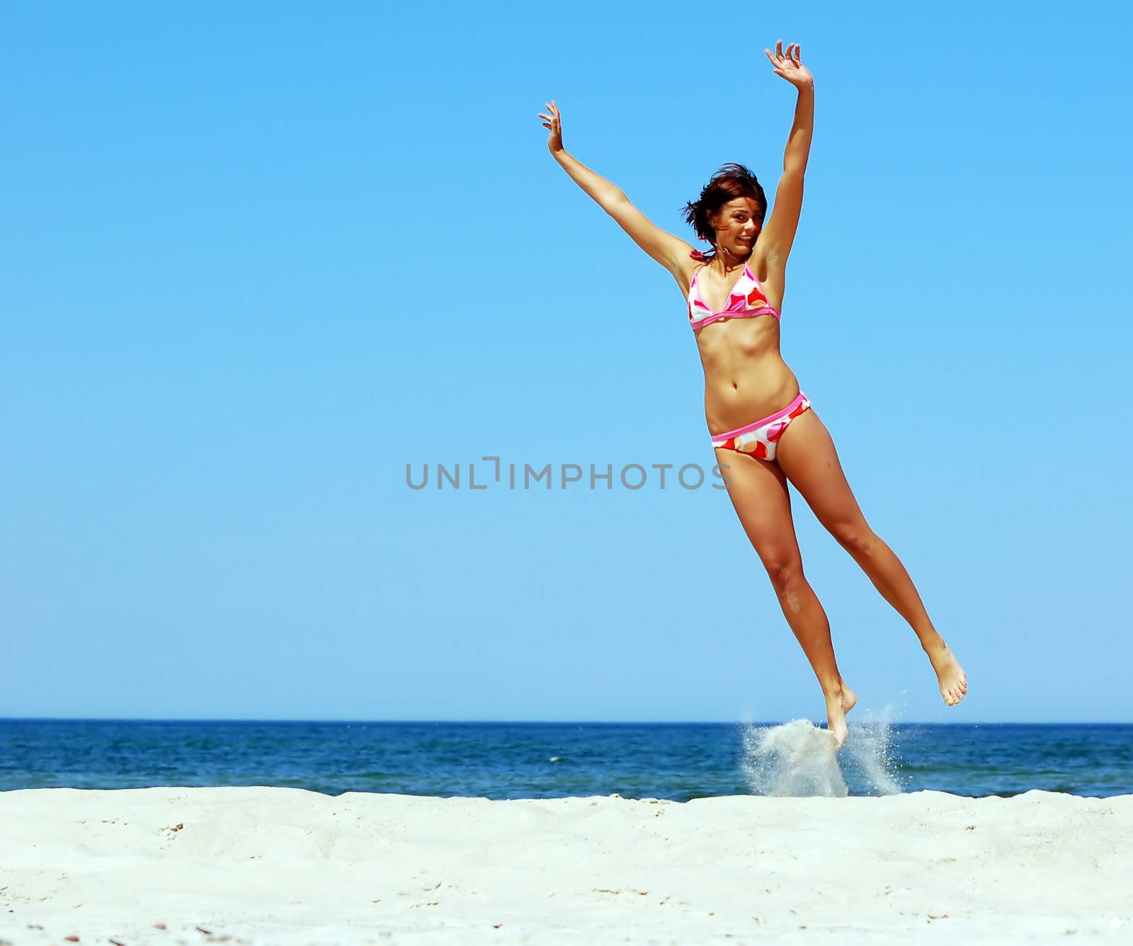 Atrractive young woman showing happiness by photocreo