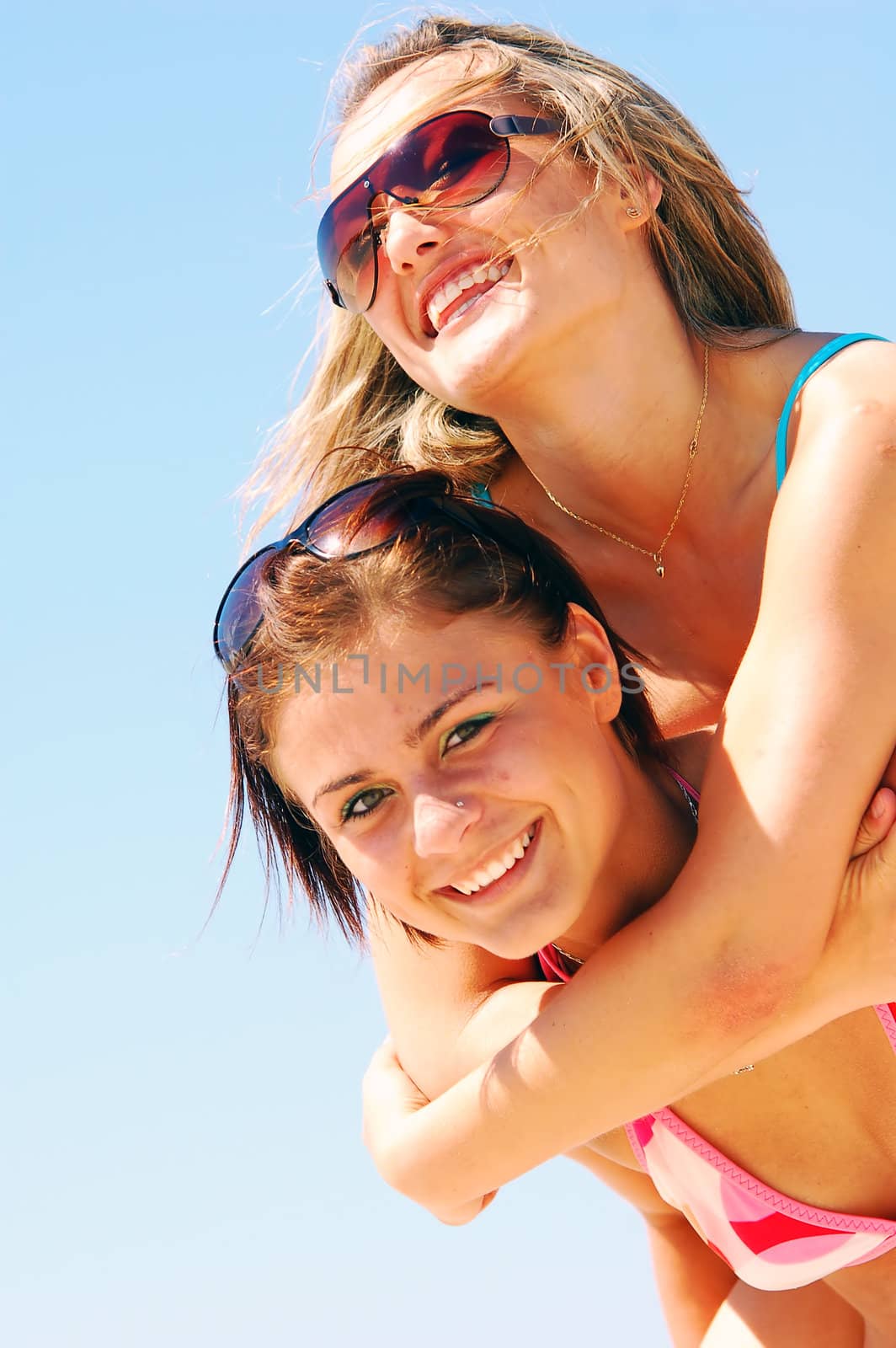 Young women on the summer beach by photocreo