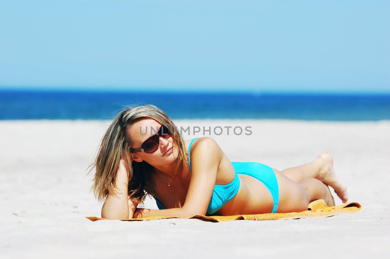 Beautiful woman on the beach by photocreo